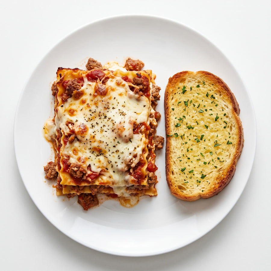 Beef and Sausage Lasagna with Garlic Bread